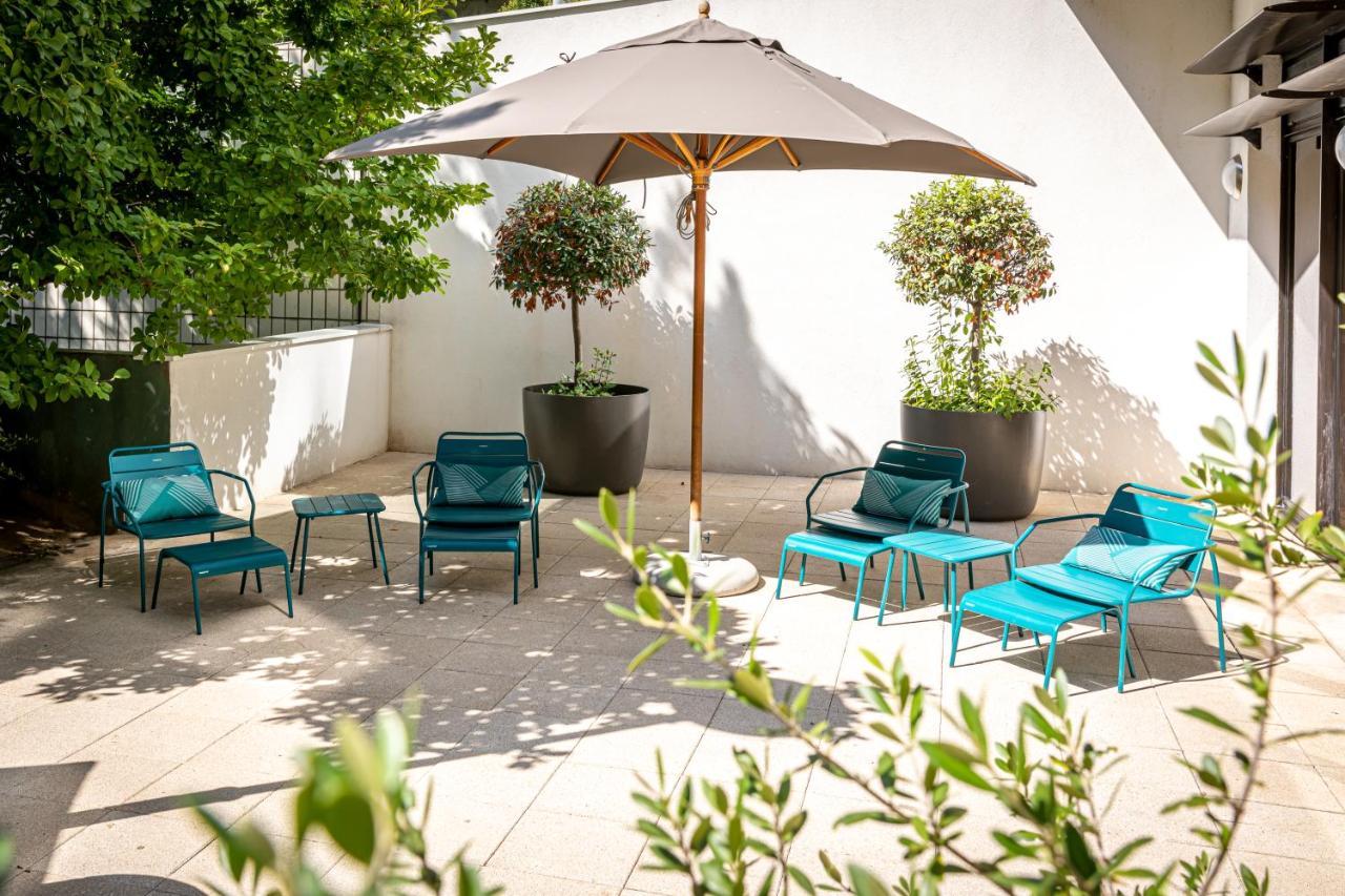 Fraser Suites Paris La Defense Κουρμπεβουά Εξωτερικό φωτογραφία The courtyard at the hotel